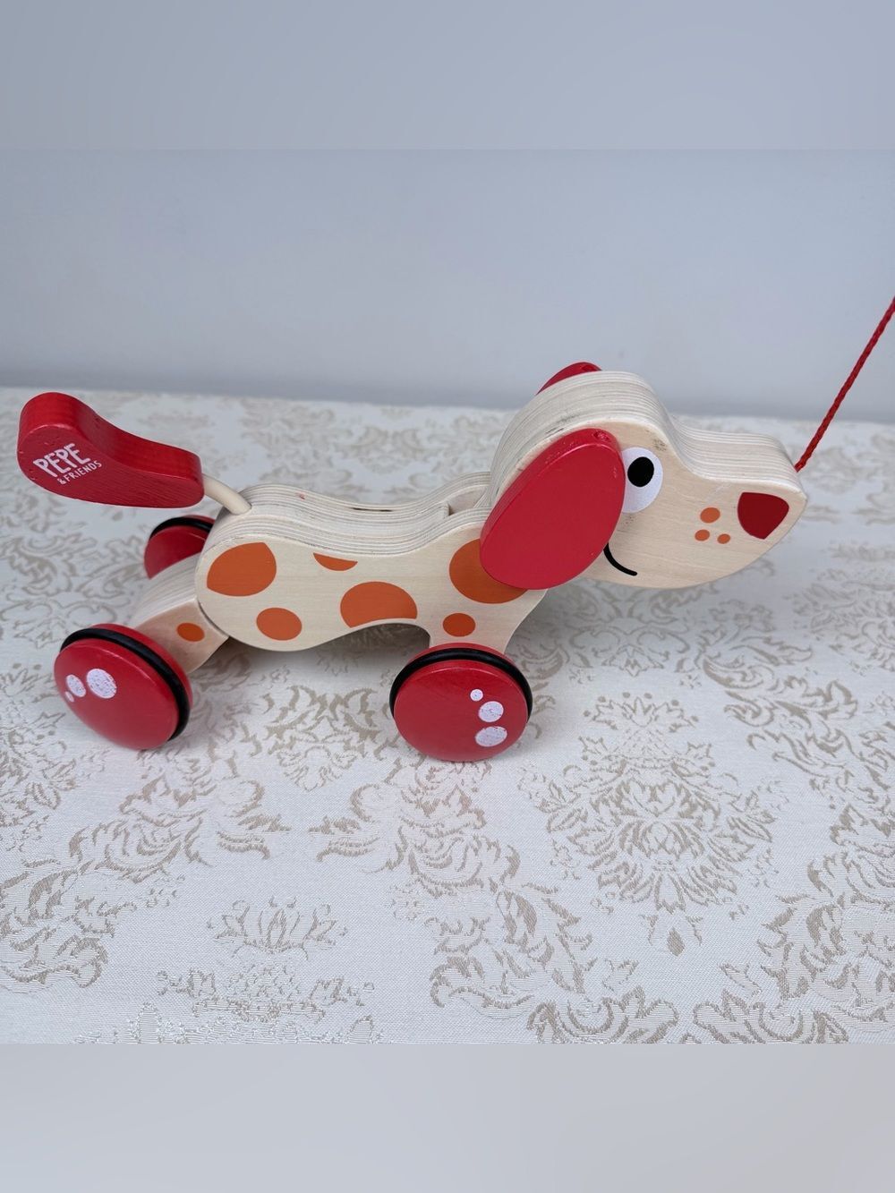 Wooden Pepe and Friends Pull-Along Puppy Toy - Red & Orange